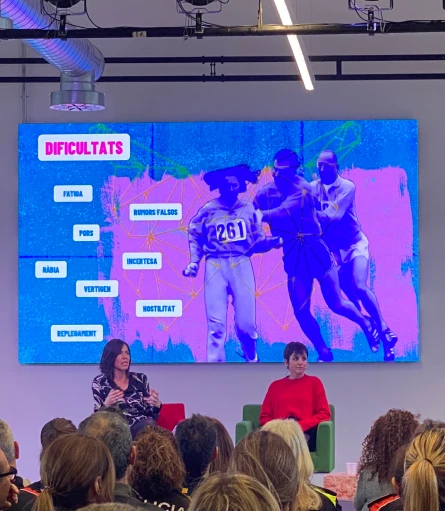 Alba Alfageme delivering a talk during the 8M event focused on equality and feminism