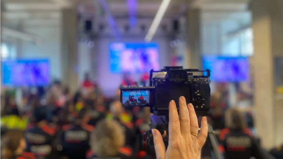 Audiovisual production team recording video capsules and digital content during the institutional event